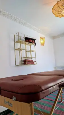 a room with a bed and a mirror on the wall at Riad Akhdar Kasbah Breakfast included in Marrakech