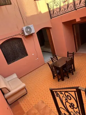 an overhead view of a patio with a table and chairs at Villa Ground Floor Rent Apt in Marrakech