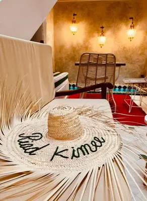 a straw hat sitting on top of a table at Riad Kimee Room 4 in Marrakech