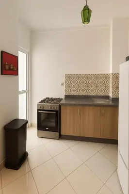 a kitchen with a stove and a counter top at Appartement Moderne & Climatisé in Marrakech
