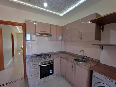 a kitchen with a sink and a stove top oven at Villa Targa in Marrakech