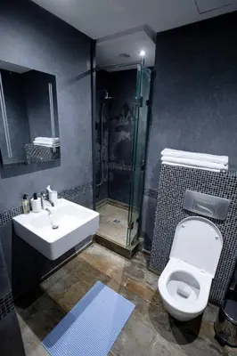 a bathroom with a shower and a toilet and a sink at Gueliz Gem Chic, Comfy & Central in Marrakech