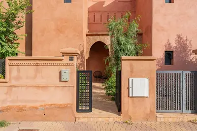 an entrance to a building with a gate at Villa Palmera - 6 people - Pool - Marrakech in Marrakech