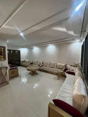 a living room with a couch and a table at Villa Marrakech in Marrakech