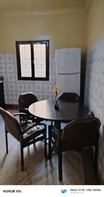 a dining room with a table and some chairs at Maison traditionnelle marocaine à Marrakech in Marrakech