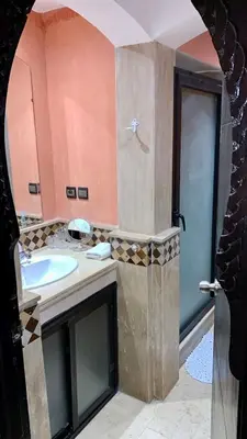 a bathroom with a sink and a shower at Appartement Miramas 2 E2 in Marrakech