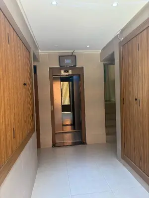 an empty hallway with a door in a building at Appartement cosy in Marrakech