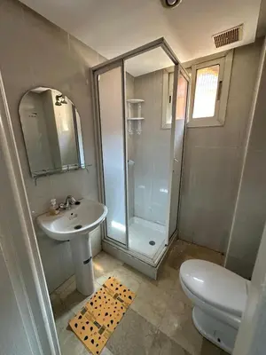 a bathroom with a shower and a sink and a toilet at le KABANA 37 face gare CTM Hivernage in Marrakech