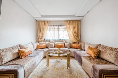 a living room with a couch and a table at Luxe 2-Bedroom with Pool in Marrakech in Marrakech
