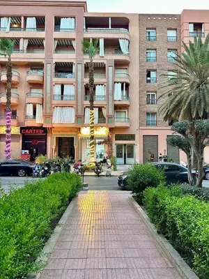 a building with a sidewalk in front of a building at Gueliz -La Kasbah AC oneBedroom Apart with parking in Marrakech