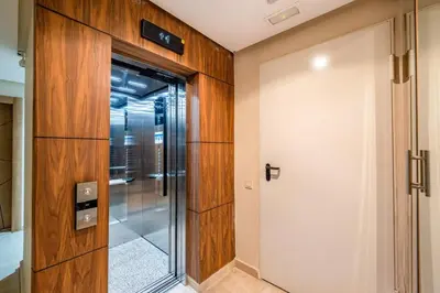 a pivot door in a room with a glass door at Appartement in Marrakech in Marrakech