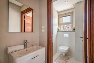 a bathroom with a sink and a toilet and a mirror at Appartement in Marrakech in Marrakech