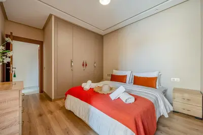 a bedroom with a large bed with two stuffed animals on it at Appartement in Marrakech in Marrakech