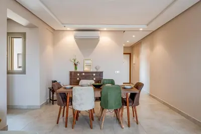 a dining room with a table and chairs at Appartement in Marrakech in Marrakech