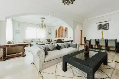 a living room with a couch and a table at Dar Saada Private Villa in Marrakech