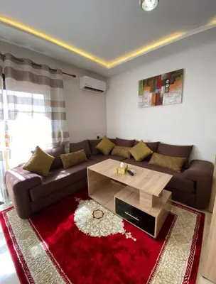 a living room with a couch and a coffee table at LUXURY Apartment Hivernage & Gueliz - Pool, Parking & 24h Security in Marrakech