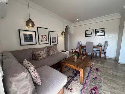 a living room with a couch and a table at Rooftop Terrasse - Centre Gueliz in Marrakech