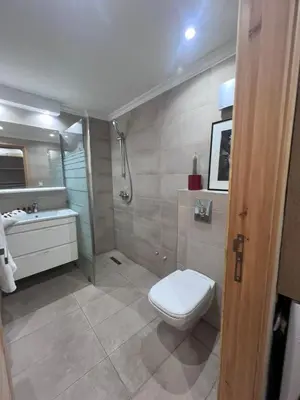 a bathroom with a toilet and a sink and a shower at Rooftop Terrasse - Centre Gueliz in Marrakech