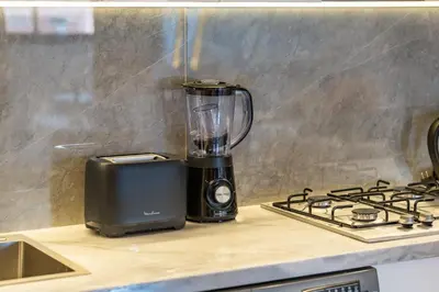 a blender sitting on a counter next to a stove at LE MAJOREL Centre Marrakech in Marrakech