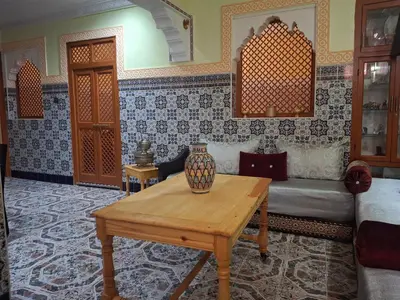 a living room with a couch and a table at Étoile de fatima - au cœur de la médina in Marrakech