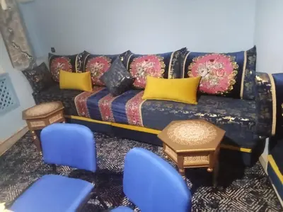a living room with a blue couch and blue chairs at appartement marrakech Gueliz in Marrakech