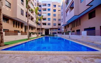 a swimming pool in the middle of a building at 5 Star City Oasis Modern and Cozy in Marrakech