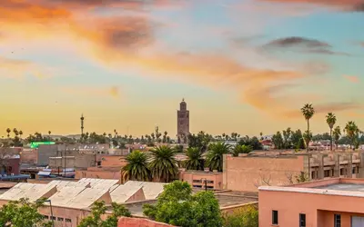 a city skyline with a clock tower in the distance at Riad Dar Mimouna -Exclusive&Brand new -Pool- 8pax in Marrakech