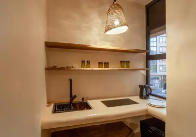 a kitchen with a sink and a counter top at Apartment in Gueliz, Riad style, equipped and central in Marrakech