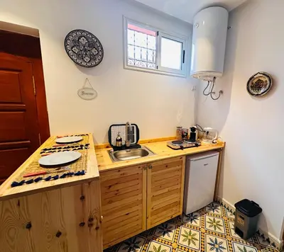 a kitchen with a sink and a counter top at Dar laarbi Kasbah in Marrakech