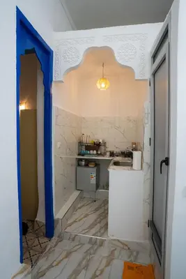 a kitchen with a sink and a counter in a room at Studio Blue Majorelle Marrakech in Marrakech