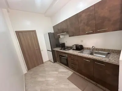 a kitchen with a sink and a counter top at Appartement Haut Standing in Marrakech