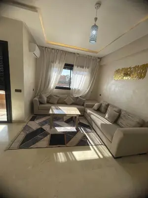 a living room with a couch and a table at Lovely apartment N15 in Marrakech