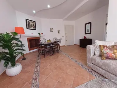 a living room with a couch and a table at Gueliz Appartement in Marrakech