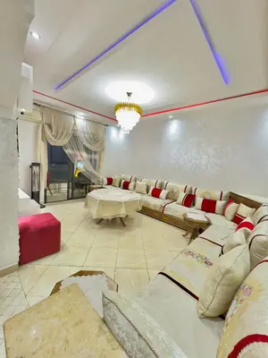 a living room with a couch and a table at Marrakech in Marrakech