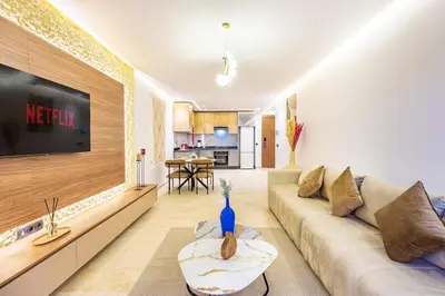 a living room with a couch and a tv at Central Gueliz 1-bedroom apartment in Marrakech