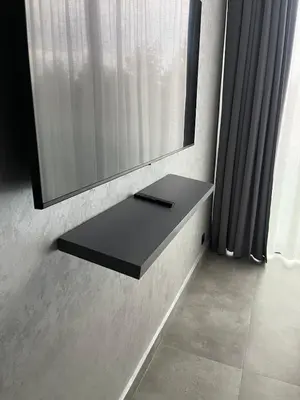 a mirror on a wall next to a window at Villa PALM GOLF AMELKIS in Marrakech