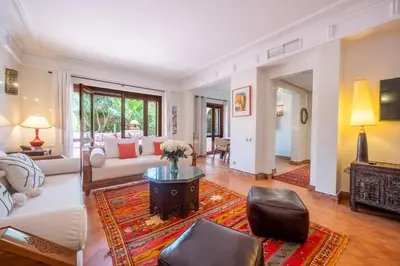a living room with a couch and a table at Chez fatina in Marrakech