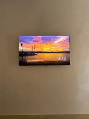 a flat screen tv hanging on a wall at Studio Cosy Proximité Confort in Marrakech
