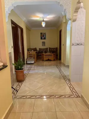 a living room with a couch and a table at Cozy room in marrakech in Marrakech