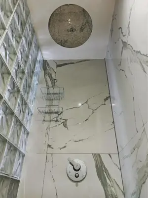 a bathroom with marble floors and a ceiling at Splendid One Bedroom center of Marrakech -Gueliz- in Marrakech