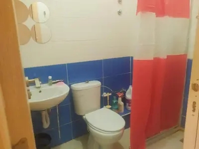 a bathroom with a toilet and a sink at Apartment Targa Reserved for Families in Marrakech