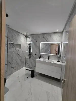 a bathroom with a sink and a mirror at Appartement avec piscine in Marrakech