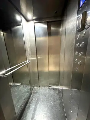 an empty stainless steel elevator in an airport at Pause rêvée au cœur de Marrakech in Marrakech