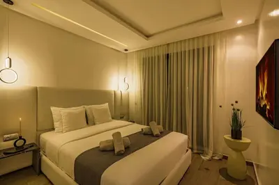 a bedroom with a bed with two towels on it at Sakina Appartement Luxe Gueliz in Marrakech