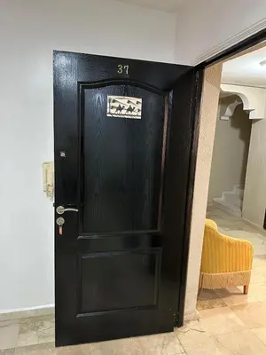 a black door with the number on it at L'AUTHENTIQUE 37 face de la gare CTM Hivernage in Marrakech
