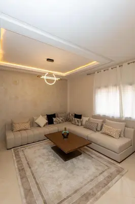 a living room with a couch and a table at Elegance and Comfort in Marrakesh in Marrakech