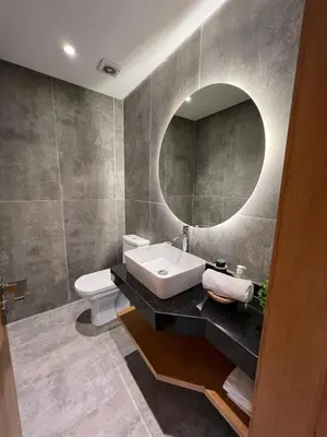 a bathroom with a sink and a mirror at Lovely 2 bedroom apartment in Marrakech