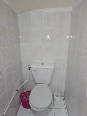 a bathroom with a white toilet in a room at Riad Zaitone 146 in Marrakech