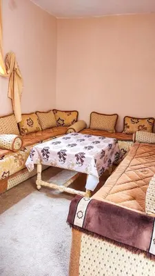 a living room with a couch and a table at light stay in Marrakech
