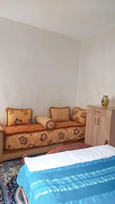 a living room with a couch with pillows on it at light stay in Marrakech